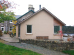 A new extension which takes advantage of the beautiful light and southerly view over the loch, and provides easy access to a partially roofed terrace.