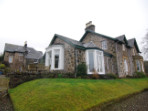 A new extension which takes advantage of the beautiful light and southerly view over the loch, and provides easy access to a partially roofed terrace.